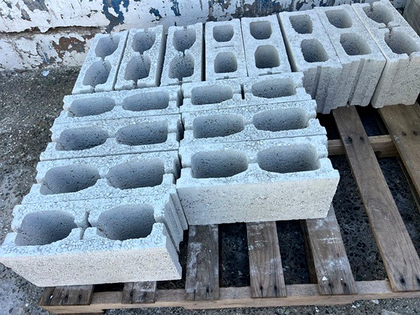 Stacks of finished concrete blocks on pallets ready for delivery